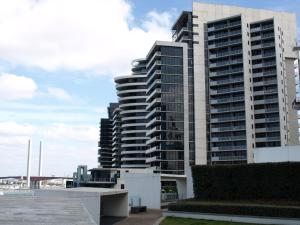 a large apartment building with a view of a harbor at ACD Apartments in Melbourne