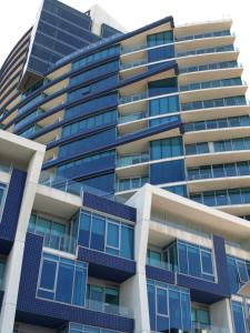 an apartment building with blue windows at ACD Apartments in Melbourne