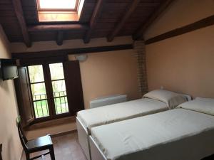 Ένα ή περισσότερα κρεβάτια σε δωμάτιο στο Agriturismo Podere Casino