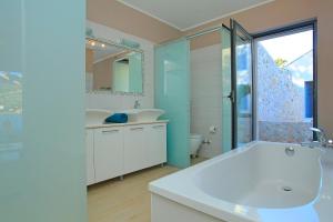 a bathroom with a tub and a sink and a toilet at Villa Tapenade in Lastovo +40 photos