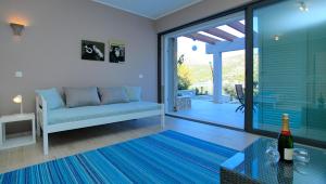 a living room with a couch and a table at Villa Tapenade in Lastovo