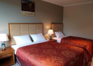 Postel nebo postele na pokoji v ubytování Albany Rosedale Motel + 16 fotografií