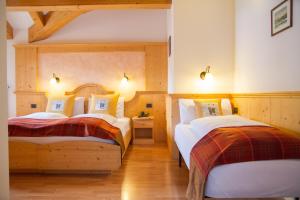 Cama o camas de una habitación en Hotel Genzianella