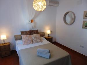 Posteľ alebo postele v izbe v ubytovaní Apartamentos Miramar II