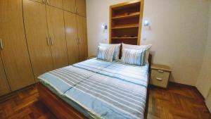 Postel nebo postele na pokoji v ubytování Apartment Harmonija