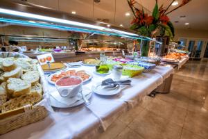 
a buffet table filled with different types of food at Hotel Suances in Suances
