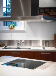 a kitchen with a sink and a counter top at la Pinède in Dinard