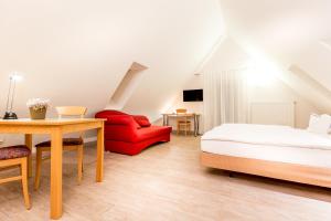 Postel nebo postele na pokoji v ubytování Hotel am Rokokogarten