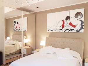 Säng eller sängar i ett rum på Varazze Suite Sauna e Hammam