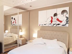 Postel nebo postele na pokoji v ubytování Varazze Suite Sauna e Hammam + 91 fotografií