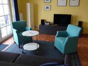 Ein Sitzbereich in der Unterkunft Villa Sanddorn