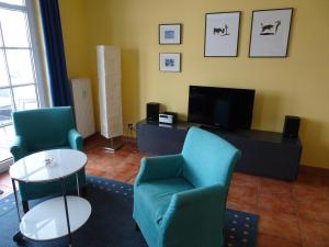 Ein Sitzbereich in der Unterkunft Villa Sanddorn
