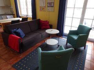 Ein Sitzbereich in der Unterkunft Villa Sanddorn