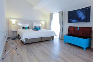 Cama o camas de una habitación en Auberge des Grands Bois