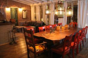 a large wooden table and chairs in a living room at Meri Boutique Hotel in Korçë