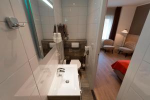 Vonios kambarys apgyvendinimo įstaigoje Hotel Bergrust