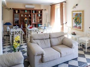 a living room with a couch and a table at Dolce Casa n41 in Savoca 