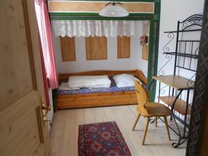 Postel nebo postele na pokoji v ubytování La vecchia Mesnerhaus