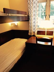 Letto o letti in una camera di Rättviksgårdens Vandrarhem