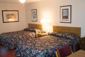 Krevet ili kreveti u jedinici u okviru objekta Tazewell Motor Lodge