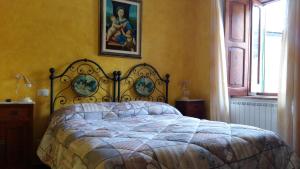 Postel nebo postele na pokoji v ubytování Borgo La Forgia