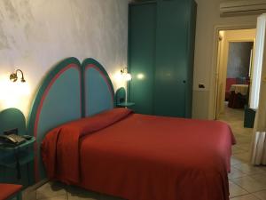 Postel nebo postele na pokoji v ubytování Alessi Hotel Trattoria