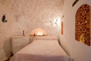 Posteľ alebo postele v izbe v ubytovaní La Constanza Casa Cueva