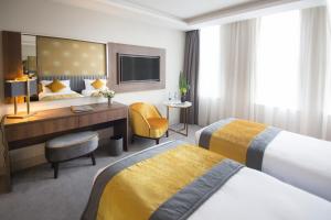 Voodi või voodid majutusasutuse Iveagh Garden Hotel toas