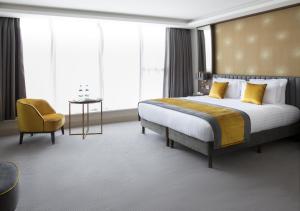 Voodi või voodid majutusasutuse Iveagh Garden Hotel toas