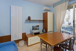 TV a/nebo společenská místnost v ubytování Residence Dei Due Porti