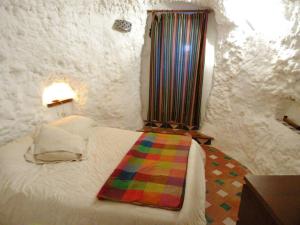 Posteľ alebo postele v izbe v ubytovaní La Constanza Casa Cueva