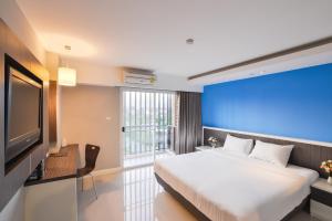 Postel nebo postele na pokoji v ubytování Napatra Hotel