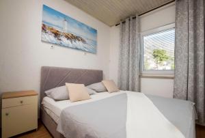 Posteľ alebo postele v izbe v ubytovaní Apartments Mikas