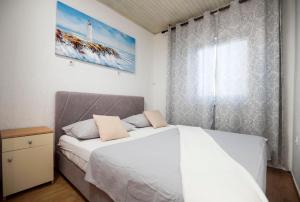 Posteľ alebo postele v izbe v ubytovaní Apartments Mikas