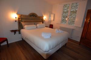 Кровать или кровати в номере Casa Acciaiuoli