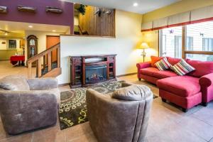 a living room filled with furniture and a fire place at Quality Inn Kodiak in Kodiak