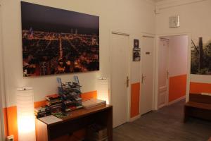 a room with a desk and a painting on the wall at Pensión Arosa in Barcelona