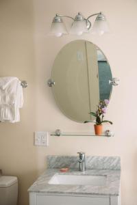 a bathroom with a sink and a mirror at The Salem Inn in Salem