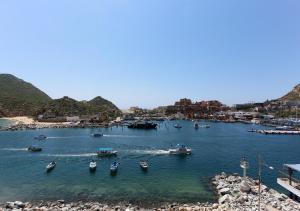 a group of boats are docked in a harbor at Breathless Cabo San Lucas - Adults Only in Cabo San Lucas