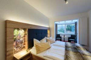 Postel nebo postele na pokoji v ubytování Wellness & Ayurveda Hotel Am Eichenberg