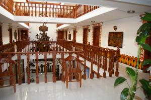 a room with a staircase with wooden railings at Hotel Misional in Santa Cruz de la Sierra