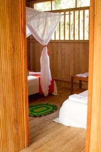 Postel nebo postele na pokoji v ubytování La Ceiba, Amazonas