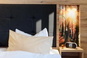 Postel nebo postele na pokoji v ubytování Wellness & Ayurveda Hotel Am Eichenberg