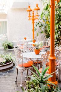 a table and chairs on a patio with plants at Inn at Venice Beach in Los Angeles