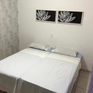 מיטה או מיטות בחדר ב-Pousada Hostel Universitário