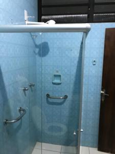 a glass door of a shower in a bathroom at Pousada Hostel Universitário in Londrina +29 photos