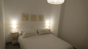 Cama o camas de una habitación en Playa y Montaña Faura-Valencia
