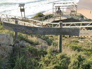 a sign on the side of a beach at The Surf Studio - Ericeira in Ericeira