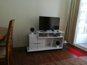 Телевизор и/или развлекательный центр в Departamento Full La Serena