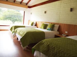 Postel nebo postele na pokoji v ubytování Hosteria Totoral
